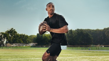 Philadelphia Eagles quarterback Jalen Hurts gets ready to throw a football on the field