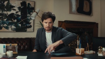 Still from Mack Weldon campaign "Comfortable Anywhere" featuring man in sweater and t-shirt