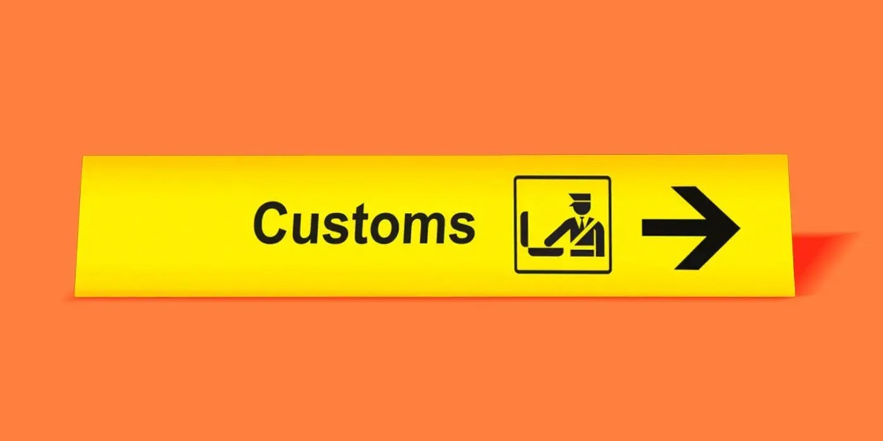 Bright yellow "customs" sign on an orange background.