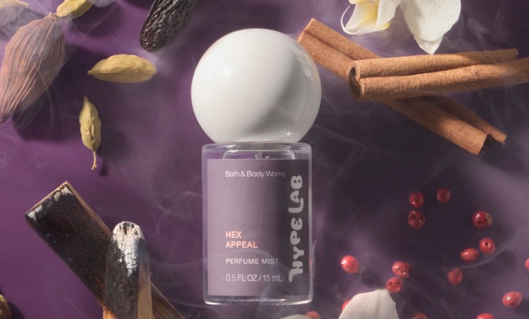 Bath & Body Works' new Hex Appeal scent on a purple background, surrounded by flowers and incense.